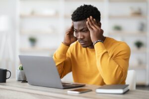 The Best Time To Schedule Your Massage Therapy Session 1 Stressed African American Manager Working On Laptop, Touching Head