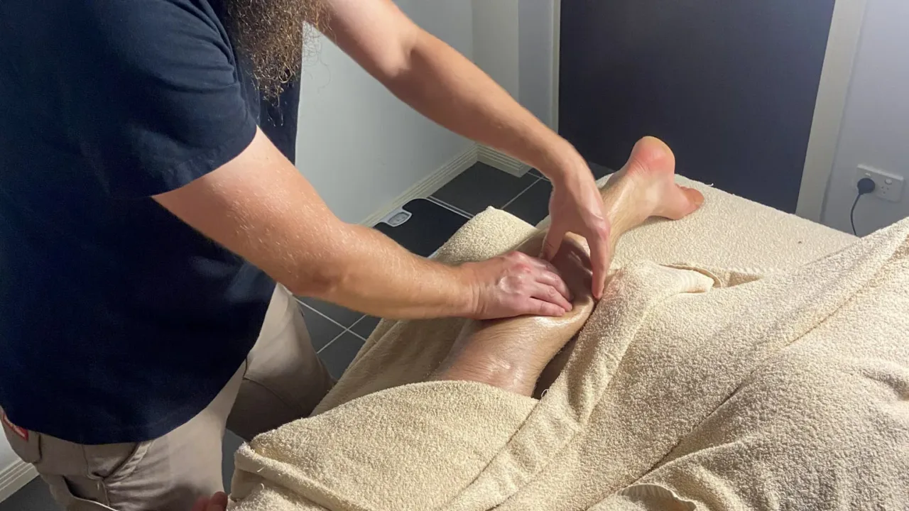 A close-up of a professional therapist providing a soothing foot massage, promoting relaxation and stress relief - relaxation massage.
