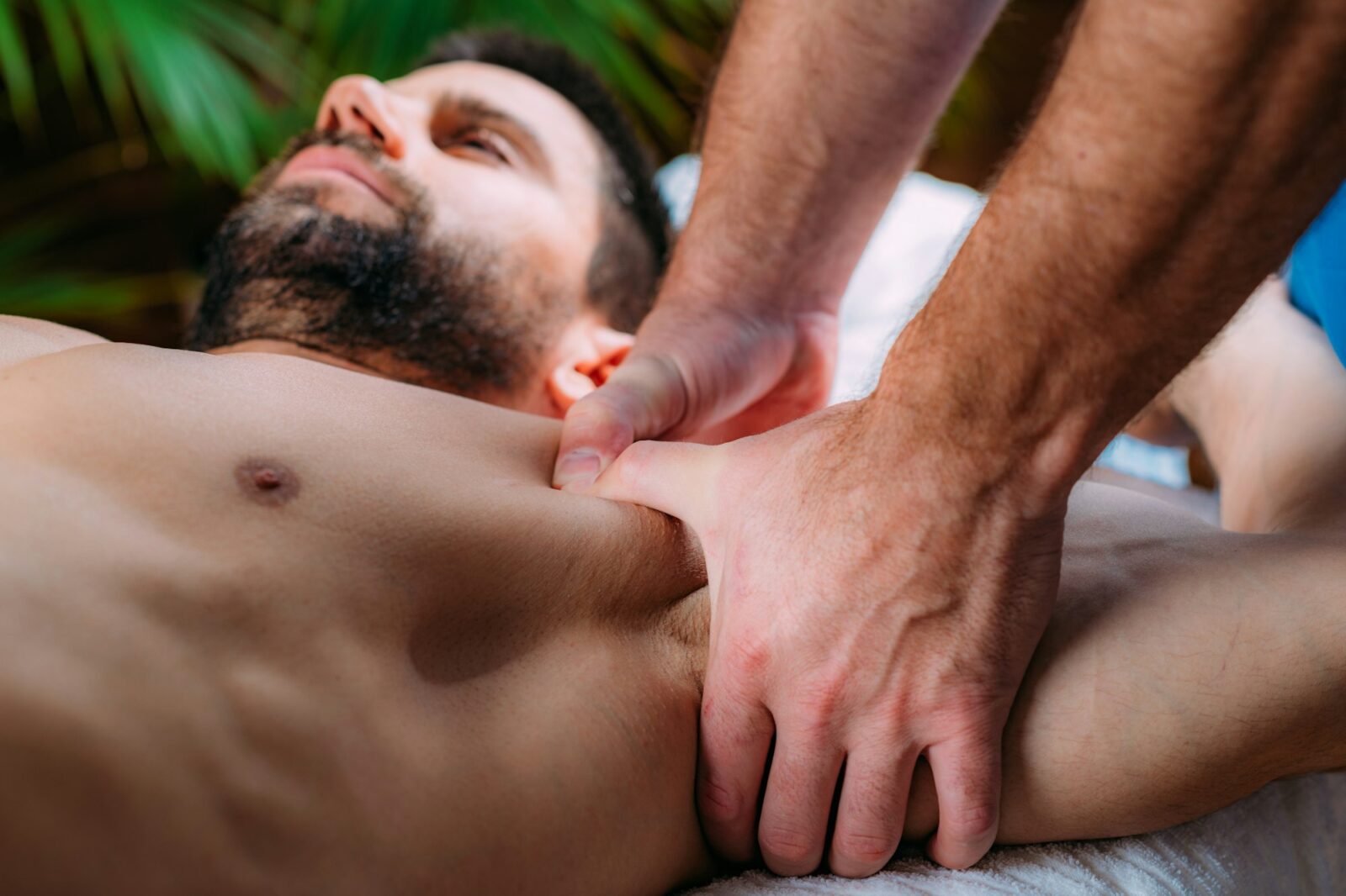 Customised Massage Therapies At Fullon Life 8 A Man Receiving A Deep Tissue Massage On His Chest From A Therapist, Focusing On Muscle Recovery And Tension Relief.